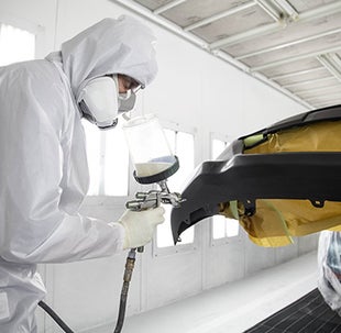Collision Center Technician Painting a Vehicle | Massey Toyota in Kinston NC
